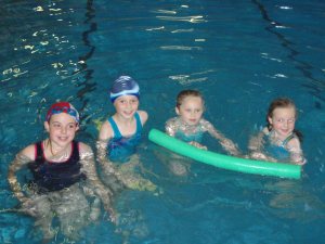 4 girls swimming 