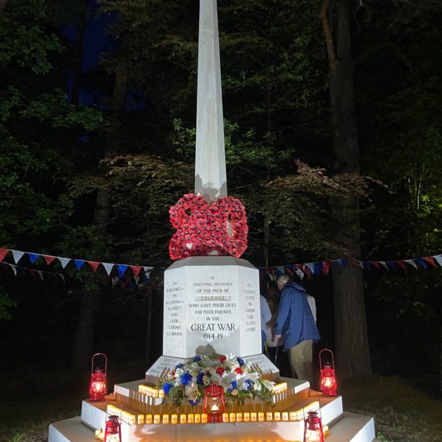 Colehill war memorial with lamps of peace for VE Day