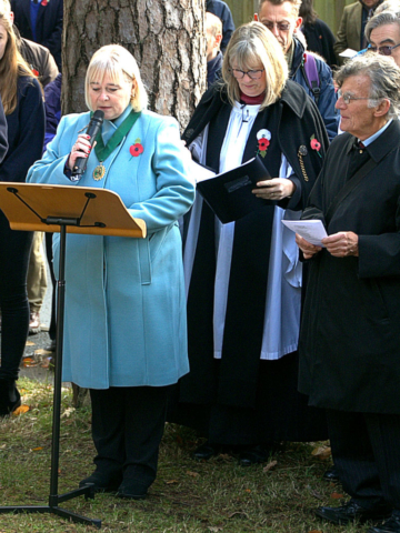 The lady chairman of the Parish Council speaking at the remembrance day ceremony